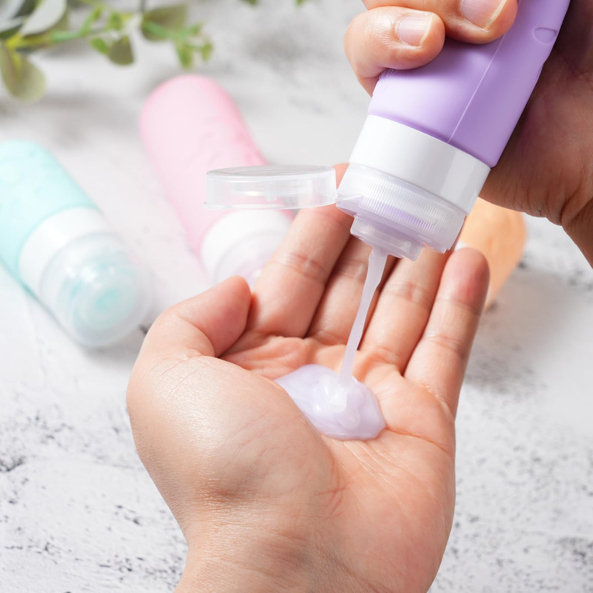 Zafit bottle in hand illustrating compact size and travel-friendly design