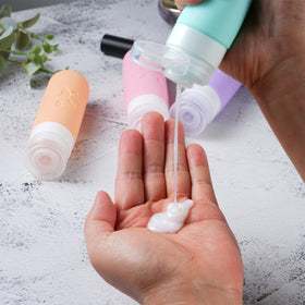 Zafit bottle held in hand for scale showing compact size and travel-friendly portability