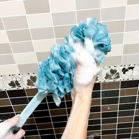 ZAIOUS person using the loofah with long handle to reach and clean back