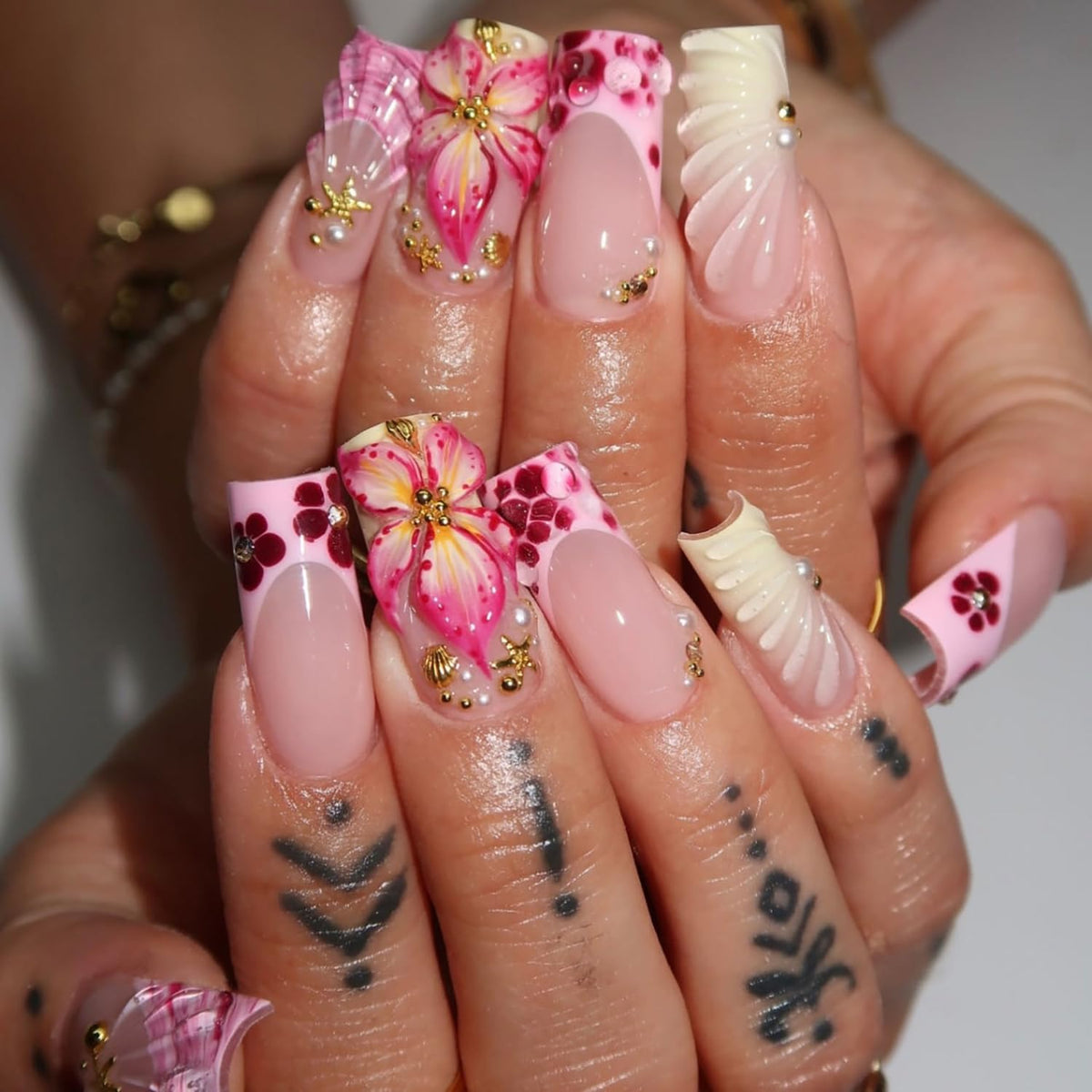 ZASKHLD pearl and rhinestone accents on nails adding sparkle and dimension