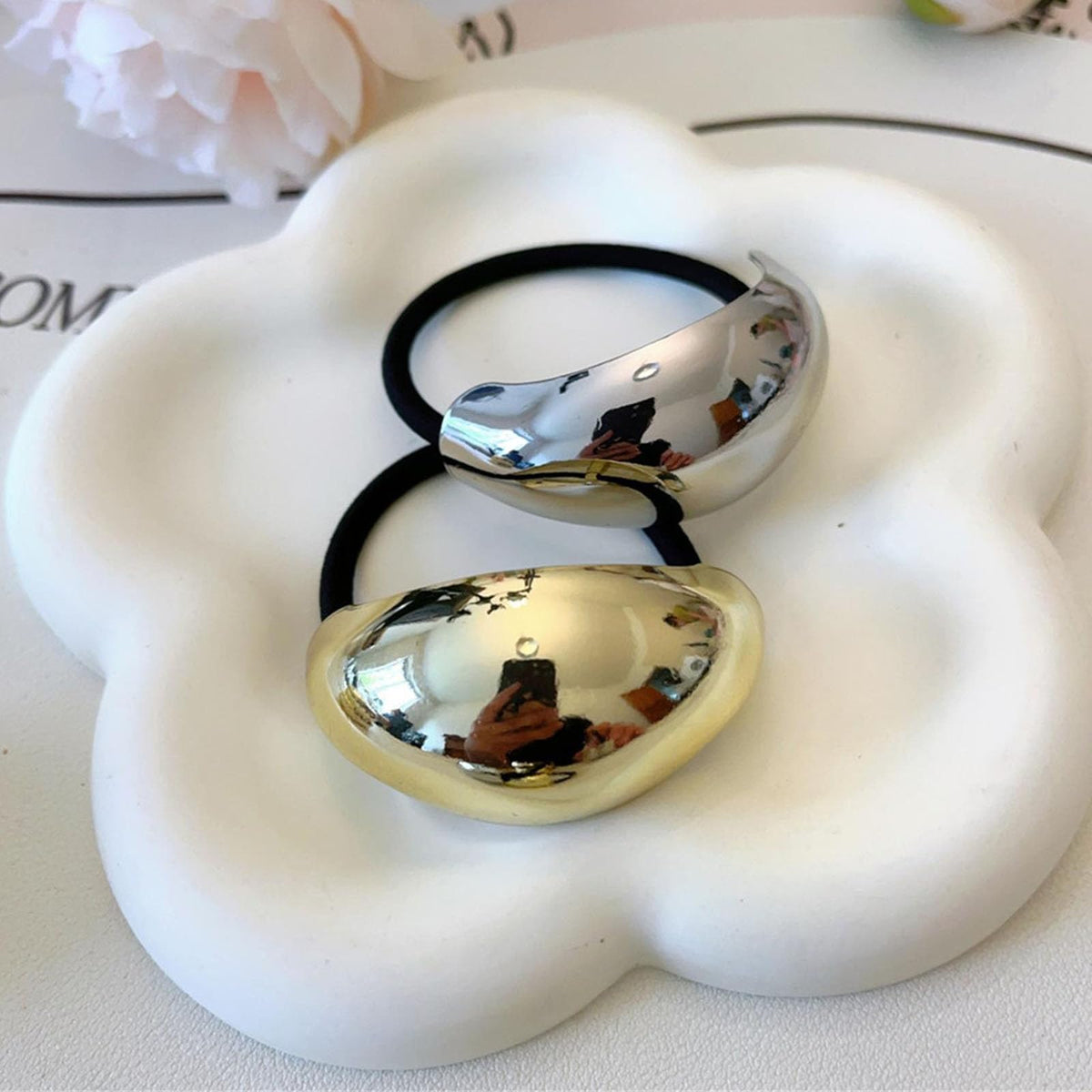 ZEYER cuff accenting a low bun for polished, damage-free hold