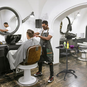 ZHOOGE salon tray cart positioned next to stylist chair demonstrating organized workflow