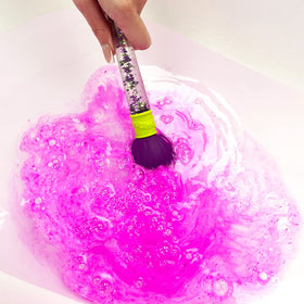 ZIMPLI magic brush beside four bath bombs, showing included tools and playful set