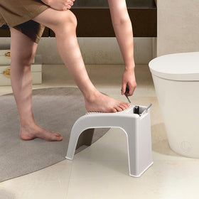 ZLMHYYM next to foot showing scale and comfortable height for leg care