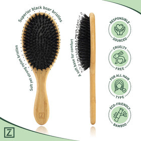 Zollo bamboo handle held in hand to show scale and eco-friendly durability benefit